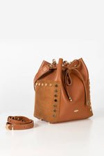 The bucket bag with a detachable strap on the left